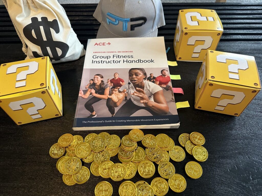 The Ultimate ACE Group Fitness Instructor Review 15 ace group fitness instructor review - ace handbook next to gold coins and yellow question mark boxes and ptpioneer hat - how much is the ace group exercise certification