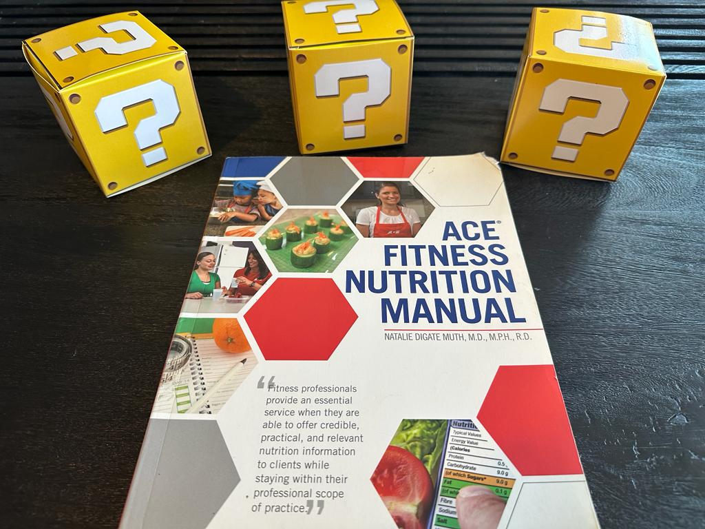 How to pick the best nutrition coach certification (Updated) 57 ACE nutrition textbook laid out surrounded by yellow question mark boxes - best nutrition certification