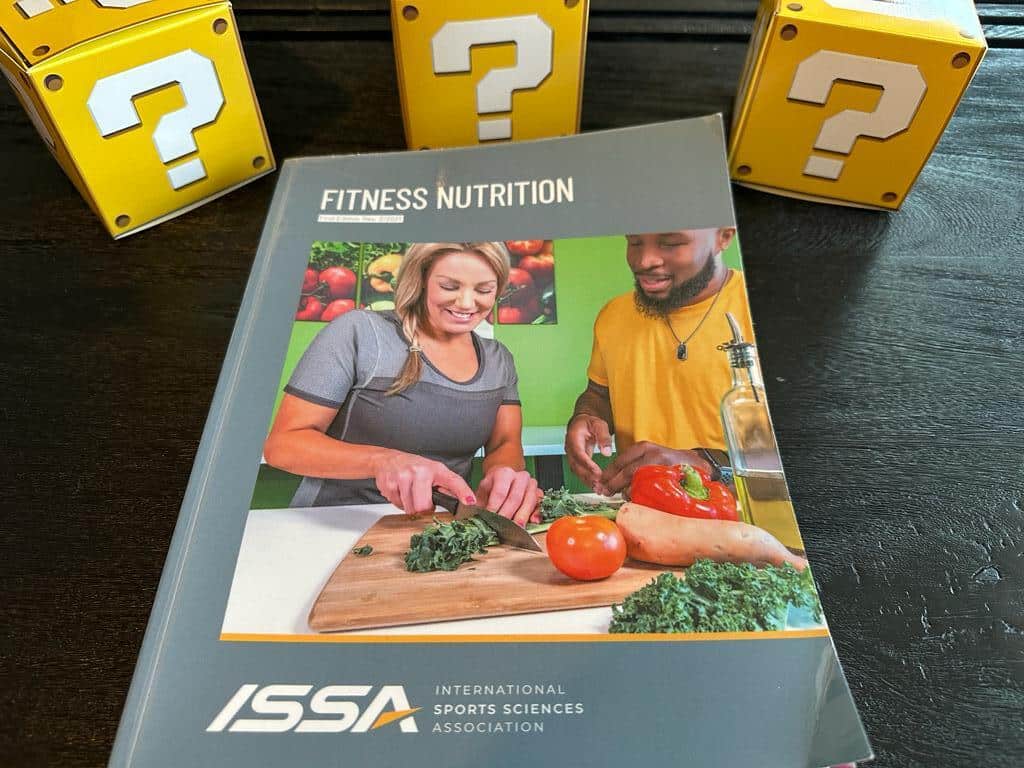 How to pick the best nutrition coach certification (Updated) 41 Best Nutrition Certifications - ISSA Nutritionist textbook, fitness nutrition surrounded by yellow question mark boxes