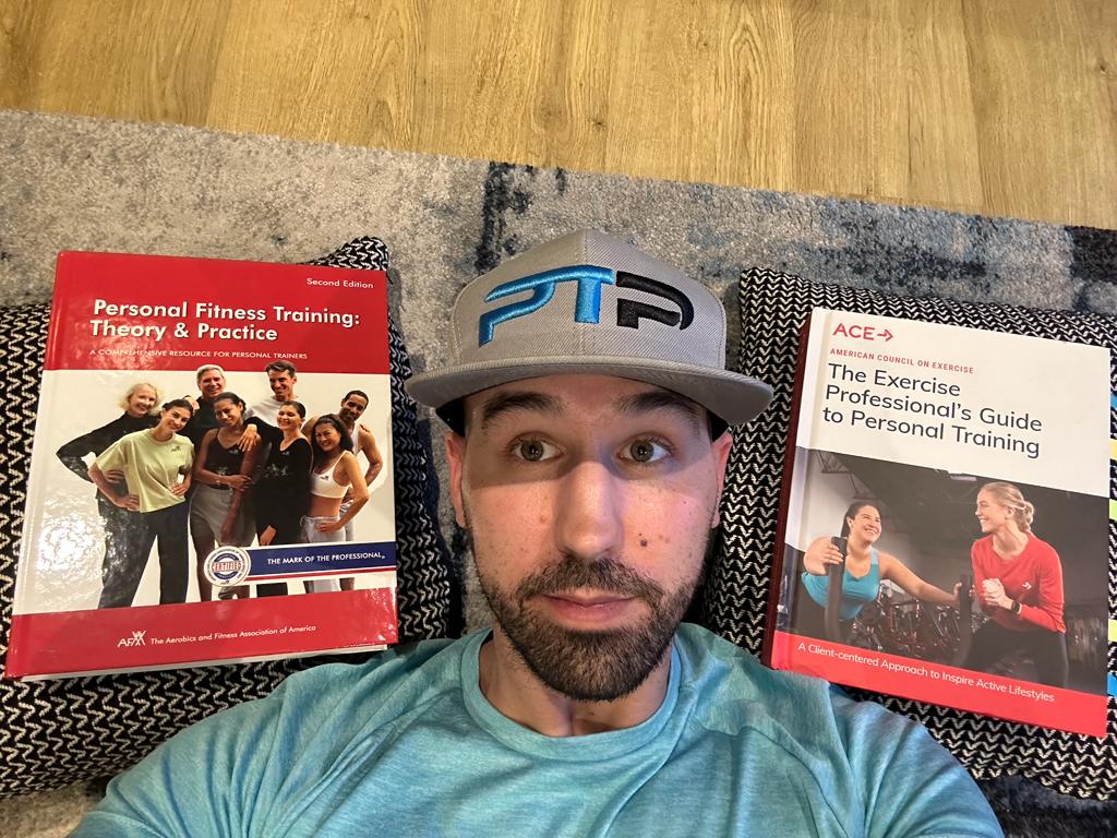 ACE vs AFAA - Tyler lays on carpet next to afaa and ace textbooks - which is best, ace or afaa