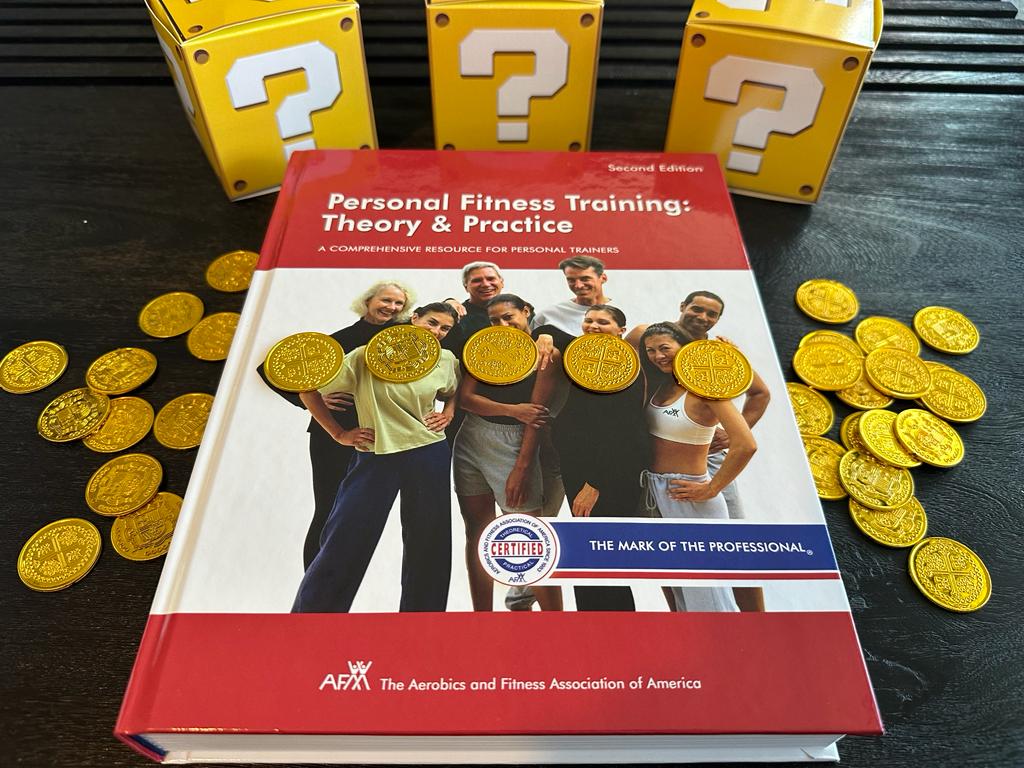Cheapest personal trainer certification guide (Updated) 45 cheapest personal training certifications - AFAA textbook laid out on table with gold coins and mystery boxes - how much does AFAA CPT cost?