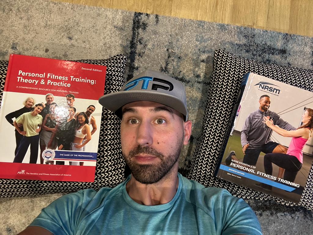 nasm vs afaa - Tyler Read lies on floor with afaa and nasm textbooks 