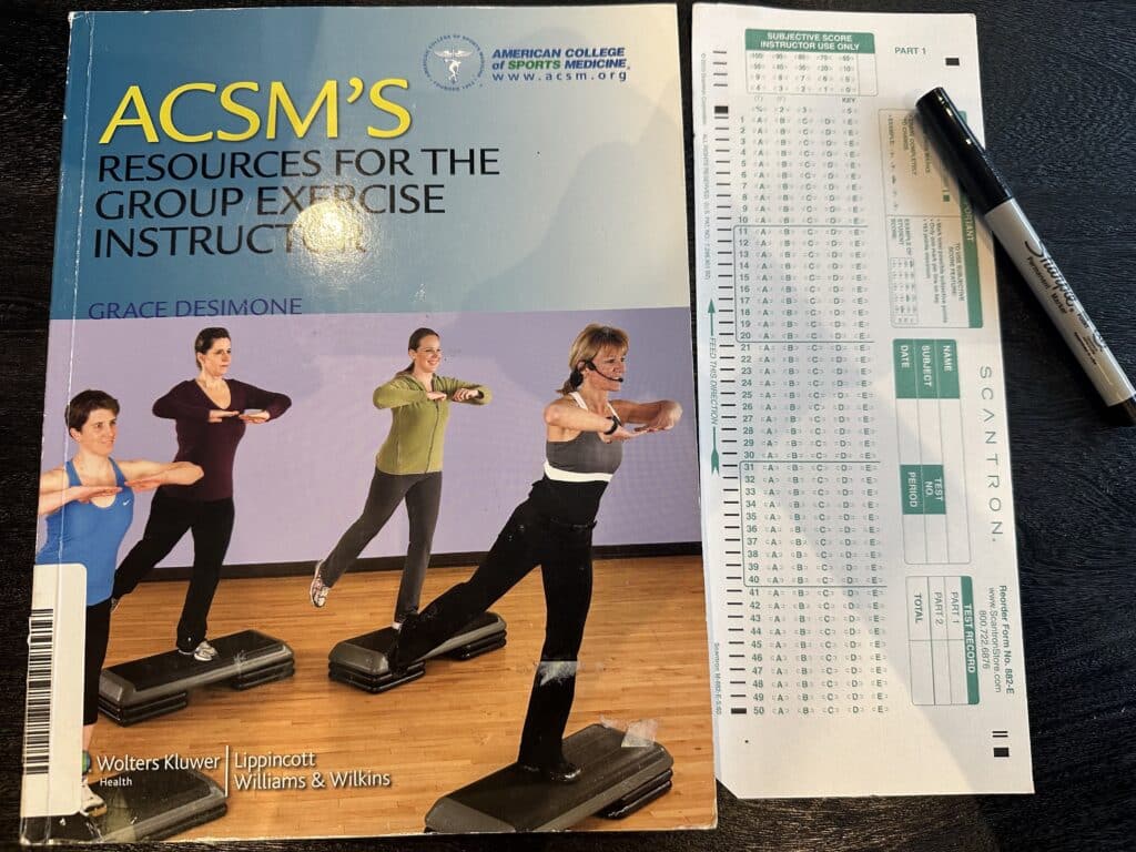 ACSM Group Exercise Instructor (ACSM-GEI) Review 22 ace group exercise certification exam - ACSM GEI exam and textbook on table