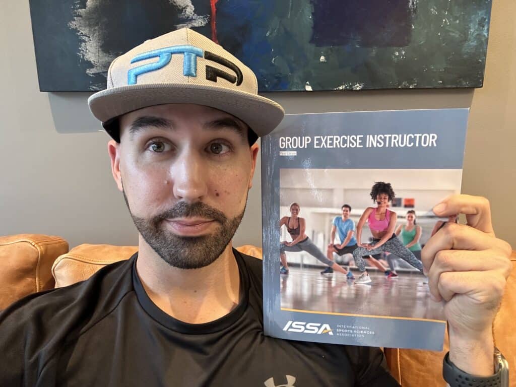 ISSA Group Exercise Instructor Certification Review 13 issa group exercise certification review - Tyler Read holds the ISSA Group Exercise textbook