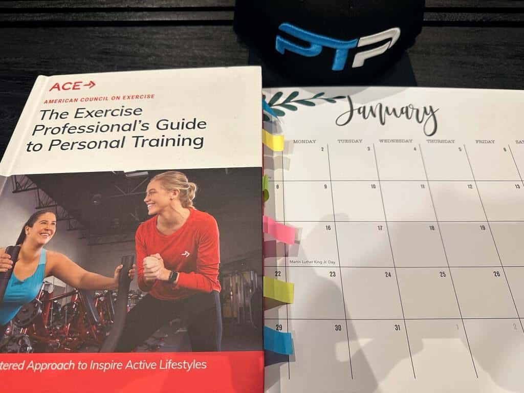 FREE ACE Study Plan, Study Calendar + Blueprint 4 ACE CPT Study Plan - ACE personal trainer textbook, calendar laid out on table with dates for planning an ACE study session.