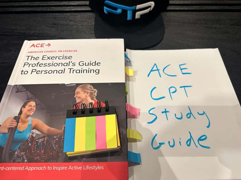 Free ACE CPT Study Guide (all 18 chapters) 11 ACE Study Guide - ACE CPT textbook laid on table for preparing for the ACE exam.