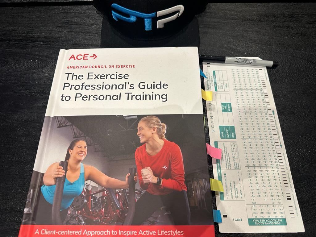 ACE CPT Practice Test – 300 Real Exam-Style Questions 14 ACE practice test - ACE textbook laid out on table with scantron sheet for the ACE exam.