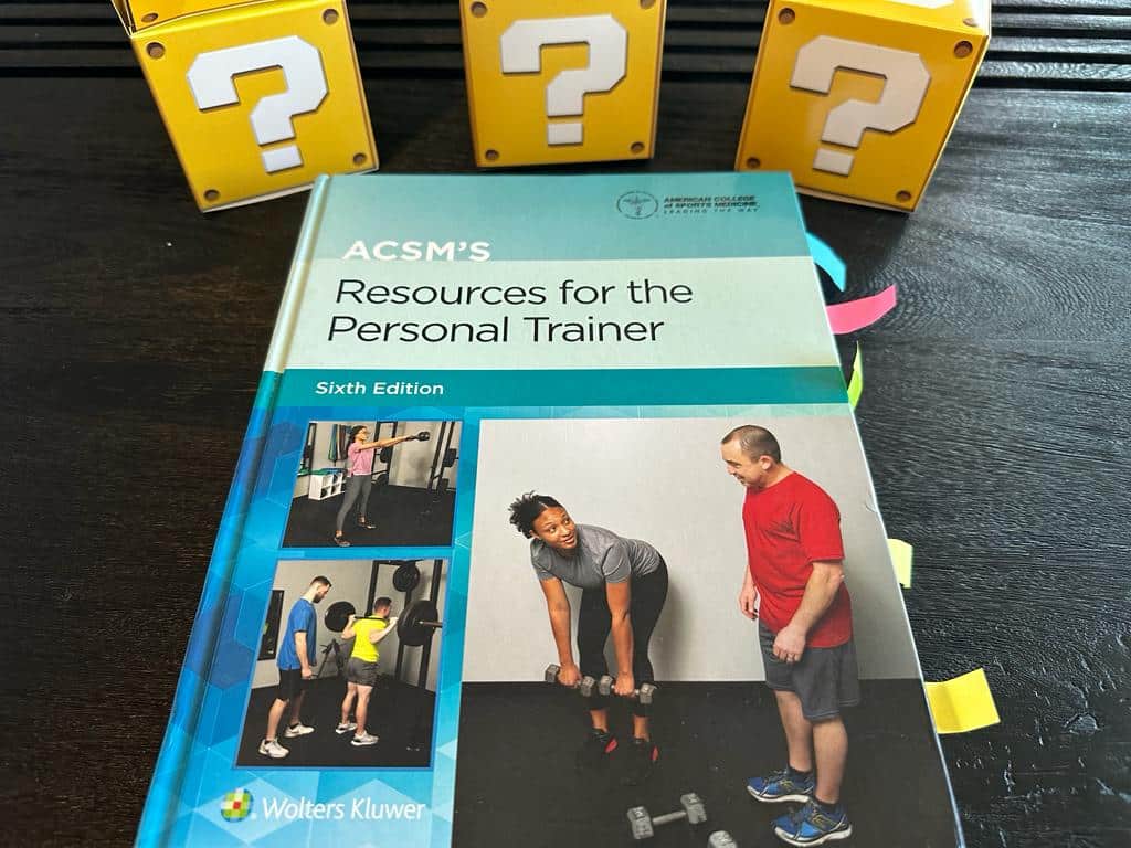 Updated: How to pick the best personal trainer certification 55 ACSM CPT - Best Personal Trainer Certification programs - ACSM textbook laid out with yellow question boxes