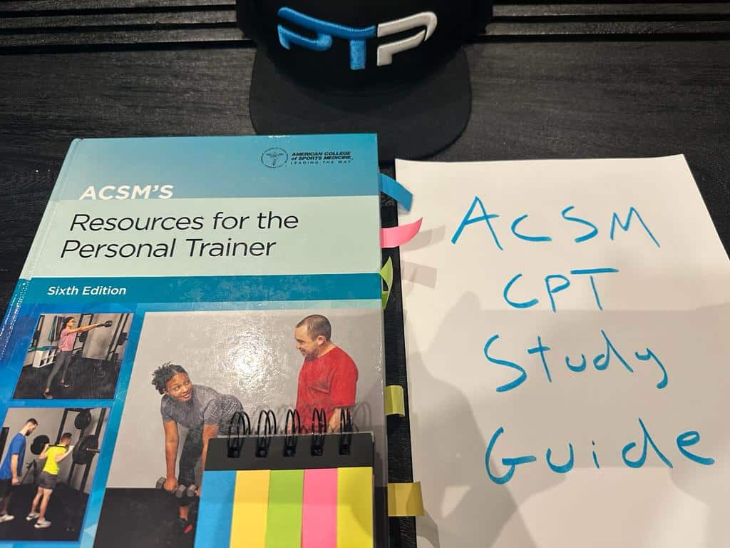 Free ACSM CPT Study Guide (all 22 chapters) 7 Free ACSM study guide - ACSM textbook placed on table in preparation for ACSM CPT studying.
