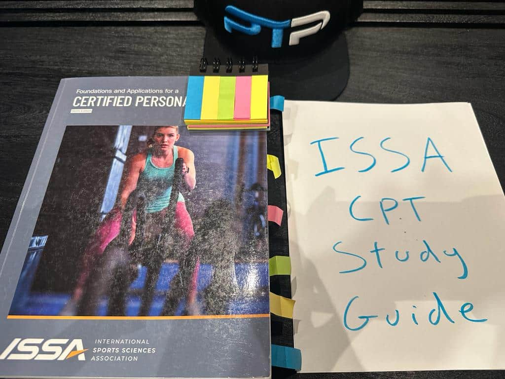Free ISSA CPT Study Guide (all 31 units) 5 Free ISSA Study Guide - ISSA personal trainer textbook displayed on table for ISSA studying