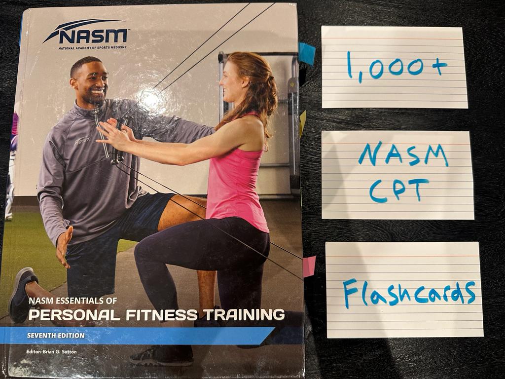 Free NASM CPT Flashcards - Over 1000 cards 2 NASM CPT flashcards - PT Pioneer - NASM personal trainer flashcards for studying - NASM with study flashcards next to textbook on desk