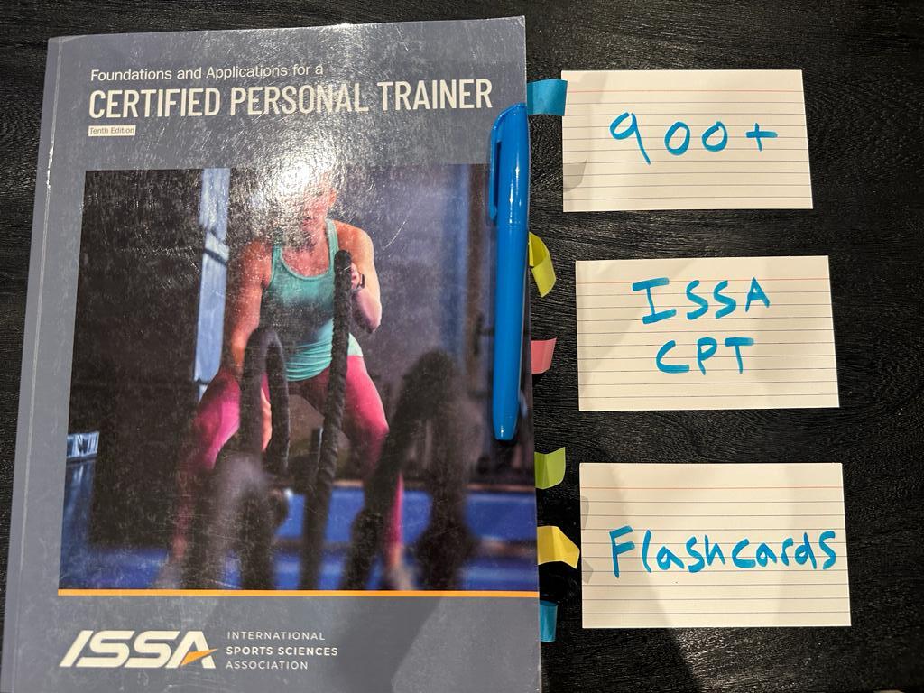 Free ISSA CPT Flashcards - Over 900 cards 3 ISSA textbook laid on table with flashcards to study the ISSA personal trainer curriculum