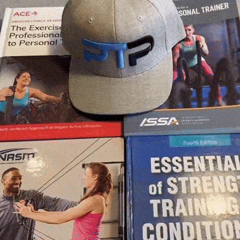 Tyler Read opening NASM textbook Kinetic Chain Checkpoints section