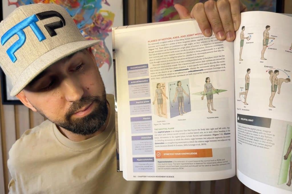 Tyler Read holds up NASM textbook chapter on Planes of Motion