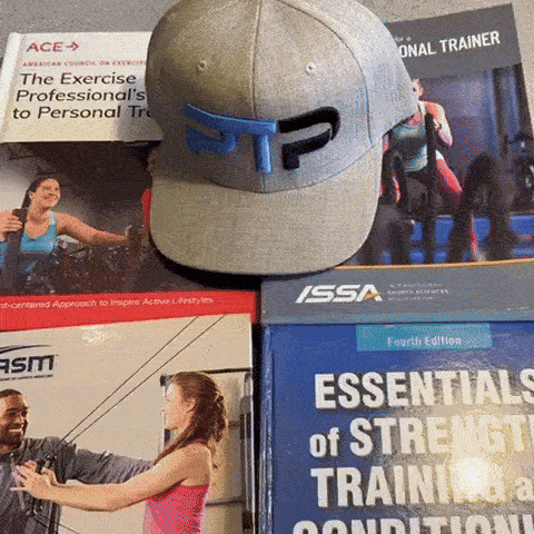 Tyler Read opens NASM textbook to 1 Rep Max conversion chart