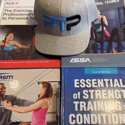 GIF of Tyler Read with certification textbooks opening NASM textbook to stages of change model section