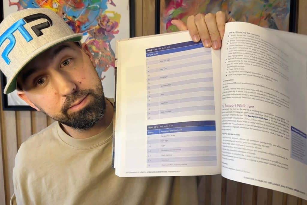 Tyler Read opens up NASM textbook to page on RPE scale for cardiovascular exercise